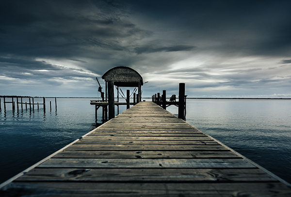 Fishermans view of yellowish orange sunrise 